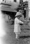 Photograph: [Toddler Standing in a Yard]