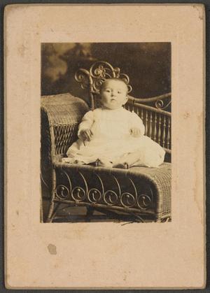 [Photograph of Baby on a Wicker Chair]