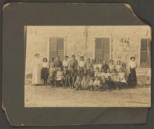 Primary view of object titled '[Beulah Hale and Forrest Hudson with Schoolchildren]'.