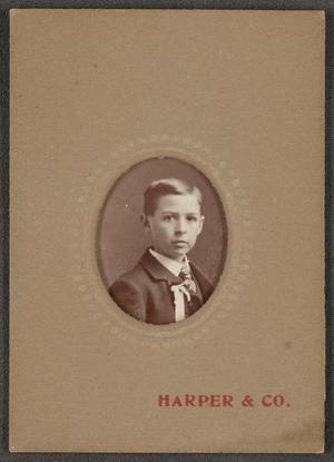 Primary view of object titled '[Photograph of Boy Wearing a Ribbon]'.