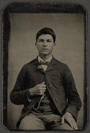 [Photograph of a Man Wearing a Striped Bowtie]