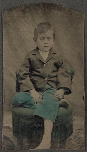 Primary view of object titled '[Photograph of a Boy Wearing Blue Trousers]'.