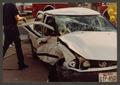 Primary view of [Heavily Damaged White Sedan]