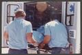 Photograph: [Paramedics Loading Patient into an Ambulance]