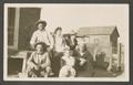 Photograph: [Granger Family Posing on a Porch]