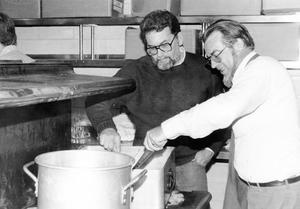 Instructor John Britt with student Eugene LaPlante stir a batch of chili for the Webb Historical Society chili dinner