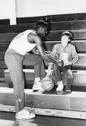Basketball player with young man1988