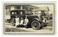Photograph: [Photograph of Koenig Family Posing on a Car]