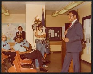 Primary view of object titled '[Lee Brown Speaking to Police Officers]'.