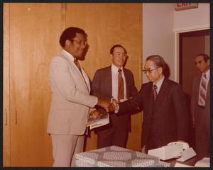 [Photograph of Lee Brown Shaking Hands With a Japanese Dignitary]