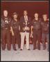 Thumbnail image of item number 1 in: '[Lee Brown Holding a Trophy with Four People]'.