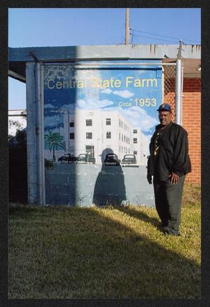 [Reginald Moore Next to the Central State Farm Prison Mural]
