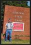 Thumbnail image of item number 1 in: '[Photograph of Bill Martin with the Central State Farm Sign]'.