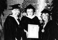 Thumbnail image of item number 1 in: 'Jean Shepherd, center, displays her honorary degree from Lee College, with John Britt, left and Muriel Tyssen'.