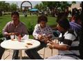 Photograph: [People sitting and eating at PACfest]
