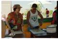 Primary view of [People working a food booth at PACfest]