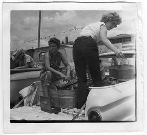 Primary view of object titled 'Billie Meeker and two women in back of pickup trucks'.