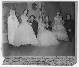 Seven young people wearing costumes