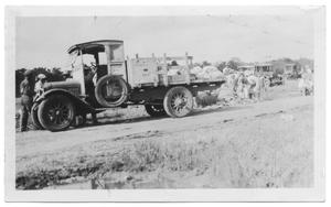 Primary view of object titled '[Filling Sand Bags For Fishtrap Road]'.
