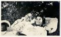 Photograph: [Two women relaxing on the ground]