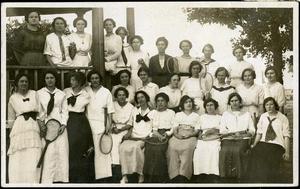 [Group of women holding tennis rackets on Simmons College campus]