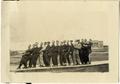 Primary view of [Group of men posing on the Simmons College campus]