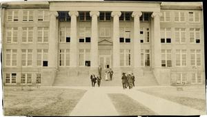 [People walking to and from a building on Trinity University campus, Waxahachie, Texas]