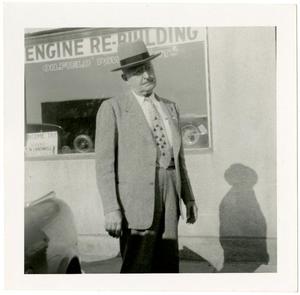 [Photo of T. N. Carswell standing in front of Abilene Machine Company/Carswell Agency]
