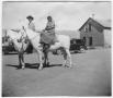 Primary view of Mr. and Mrs. E.L. Jones on horseback