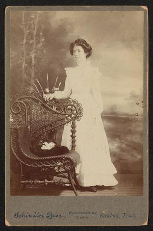[Portrait of an Unknown Woman Next to a Wicker Chair]