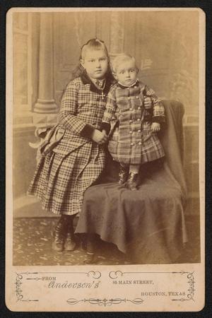 [Portrait of Two Unknown Children With an Armchair]