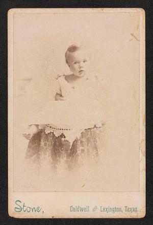 [Portrait of an Unknown Baby on a Cushioned Platform]