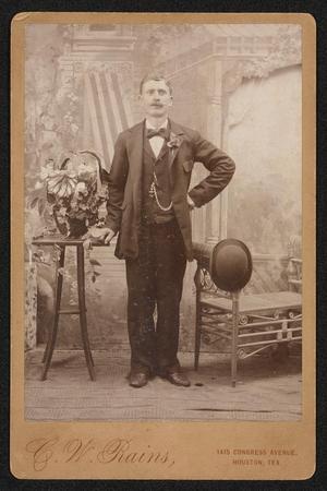 [Portrait of an Unknown Man Standing Next to Flowers]