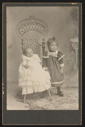 [Portrait of Two Unknown Children with a Wicker Chair]