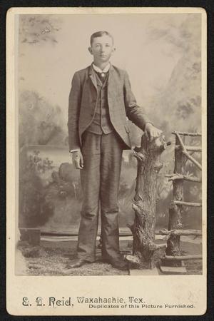 [Portrait of an Unknown Man Standing Next to Log]