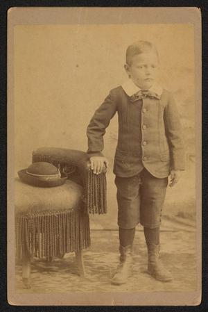 [Portrait of an Unknown Boy Next to Chair]