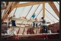 Photograph: [View of Workers Constructing Outer Edge of Roof from Interior #1]