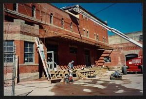 [Workers Constructing Deck in Museum Courtyard]