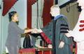 Photograph: Honors Day, Marcha Thomas-Blades accepting an academic award from Dr.…