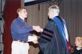 Photograph: Honors Day, Chris Cook receives a certificate and regents scholarship…