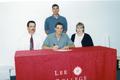 Thumbnail image of item number 1 in: 'Aaron Woodard signs a scholarship agreement to play basketball for Lee College, on hand for the signing are parents, seated, Tommy Woodard and Melanie Baily, along with Roy Champage, standing , Lee College basketball coach.'.