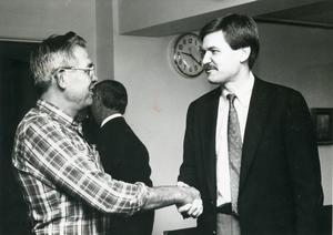 Richard Inman, right with D.K. Heard, Lee College maintenance employee at a reception held in his honor