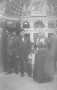 Primary view of [Carry Nation dressed in black holding book, standing with a group of men]