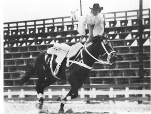 Cowgirl Performing on Horseback