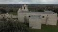 Photograph: [Presidio La Bahia: Chapel Aerial Exterior, Side View]