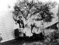 Photograph: Bideault Family Gathered underneath a Tree