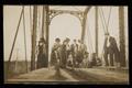 Primary view of [Postcard of a Group on a Railroad Bridge]