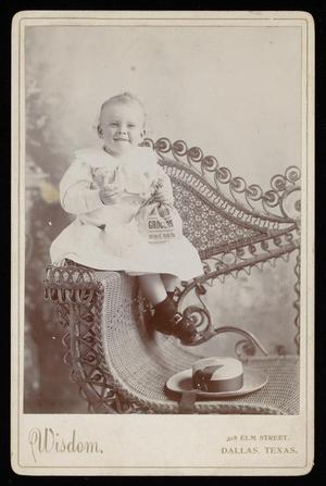 [Portrait of a Child in a Wicker Chair]
