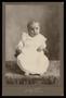 Photograph: [Portrait of an Child in a Small Upholstered Chair]
