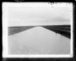 Photograph: [Dirt Canal with Two People]